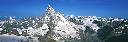 Panoramic of high mountain peaks in the Alps.