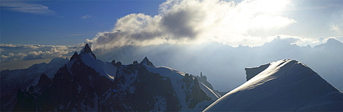 Panoramic of high mountain peaks in the Alps.