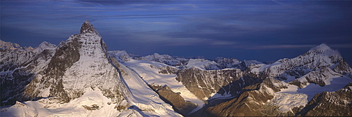 Panoramic of high mountain peaks in the Alps.