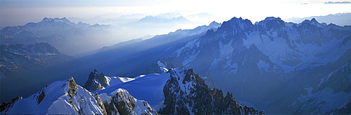 Panoramic of high mountain peaks in the Alps.