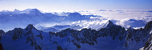 Panoramic of high mountain peaks in the Alps.