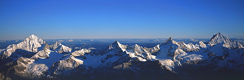 Panoramic of high mountain peaks in the Alps.