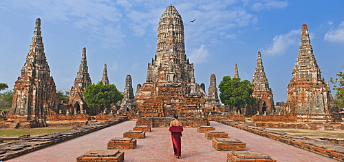 woman in red dress at the ancient temple of Wat Chaiwatthanaram in Ayutthaya