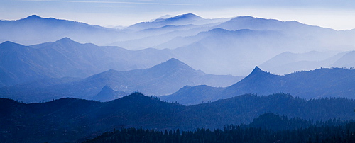 Mountain peaks behind a haze filled valley in the Sequoia National Forest, United States of America