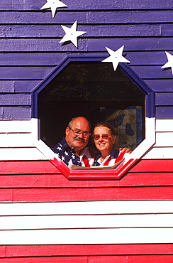 Wally and Hellen Rogers of Standish, Maine proudly display their home which is painted on all sides like the American Flag. Long before 9, 11 and the rejuvenation of patriotism and the increased display of Old Glory, the Rogers decided to wear their pride blatantly on the outside walls of their home.