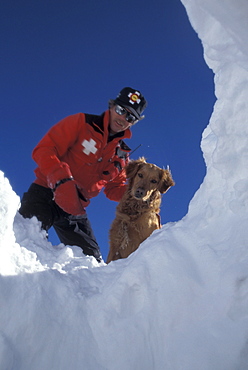 An avalanche rescue dog, trained to sniff out victims buried in avalanches, finds a buried practice victim buried in the snow on the slopes of Snowmass Ski Resort, near Aspen, Colorado