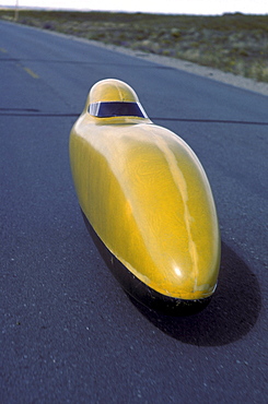 Engineers, athletes and enthusiasts gather on a lonely road in the San Luis Valley in central Colorado to try to break the speed record for a human powered vehicle. These vehicles are basically very, very aerodynamic bicycles.