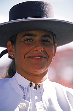 In Sevilla, locals show their equine history and flamenco spirits by parading their horses and wagons while dawning traditional flamenco dresses and flat brimmed hats.