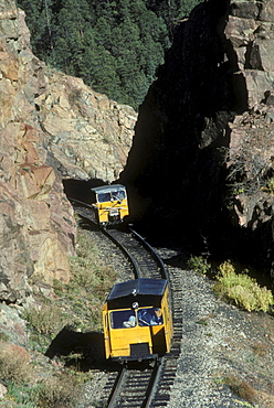 Pop cars, or maintenence cars, of the Durango & Silverton Narrow Gauge Railroad on the tracks between Durango and Silverton, Colorado