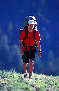 Tony Brunello hikes, backpacks up hill near Kirkwood Ski Resort, California. Kirkwood is considered part of the Lake Tahoe region.