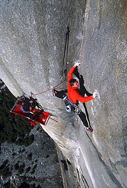 Tommy Caldwell doing the second free ascent of The Zodiac on El Capitan, Yosemite National Park, California. Caldwell is one of the worlds leading rock climbers. In the lower third Caldwell's climbing partner, Kevin Swift, is visible belaying while laying on his portaledge.