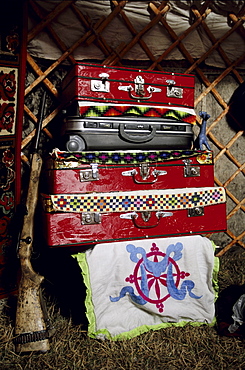 Interior of a ger. The internal layout of a ger is universal throughout Mongolia. Treasured possesions are kept in suitcases and boxes in the back of the ger. Tavanbogd National Park, Mongolia.