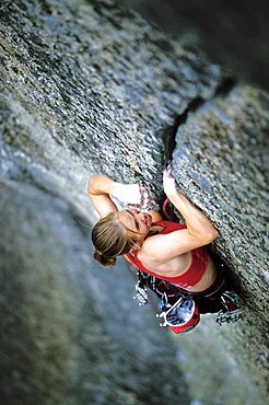 Beth Rodden rock climbing, crack climbing on the famous Phoenix 5.13a finger crack in Yosemite National Park, California.