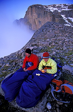 Tommy Caldwell and Beth Rodden keep warm in their sleeping bags at their bivy site while camping high on a ridge off of Longs Peak in Rocky Mountain National Park, Colorado. The Diamond is a 2000 thousand foot rock face popular for rock climbing (see background).