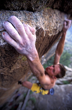 Tommy Caldwell rock climbing Grand Ol' Opry 5.14b at the Monastery near Estes Park, Colorado. Caldwell is one of the worlds leading climbers, despite having cut off one of his fingers.