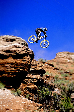 Wade Simmons making a jump on his mountain bike at the NWD 6 competition in Virgin, Utah.