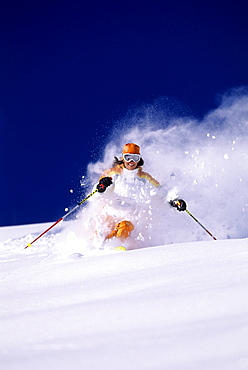 Suzanne Montgomery sking powder at Snowbird resort in Snowbird, Utah.