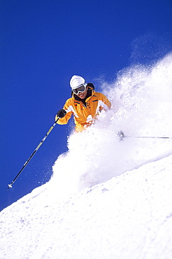 Heather Walker sking powder at Snowbird resort in Snowbird, Utah.