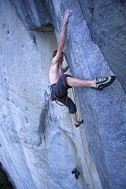 Tommy Caldwell free climbing on the crux pitch, 5.14, of the Dihedral Wall during his first ascent of the route on El Capitan in Yosemite National Park in the Sierra Nevada Mountains, California.