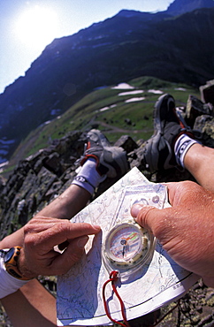 Patrick Harper uses a compass and a topographic map to navigate through the mountains above Ouray, Colorado. Harper, a member of Team Montrail, was practicing his navigation skills for the Primal Quest adventure race. Harper trained in the mountains above Ouray, Colorado for a month before the event to get better acclimatized to the high elevation.