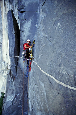 Bob Porter makes his way up Zodiac, a 16 pitch 5.11 A3+ route on El Capitan in Yosemite National Park, California.