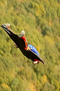 Unknown Base Jumper leaps off the Rt. 19 bridge over the New River Gorge at Fayetteville, WV for the Annual Bridge Day event.