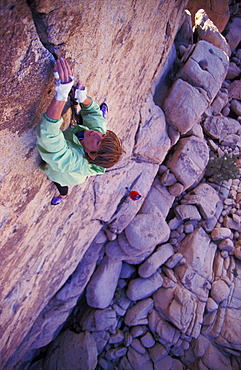 Rock climber Rikke Ishoy makes her way up a thin crack climb in Joshua Tree National Park, California.