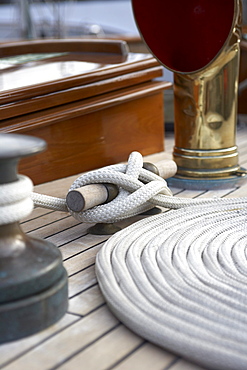 WInch, cleat and coil on deck of sailing yacht "Sincerity."