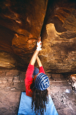 Zoe Hart bouldering at the Crack House, Moab, Utah.