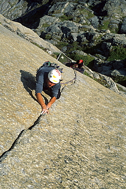 Male climbs a crack on the Phoenix in Canada's Northwest Territories.