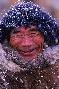 Inuit actors dress in traditional seal skin clothing.