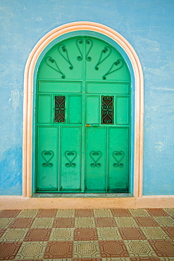 A bright green door at an entrance to a church Santa Cruz, Guatemala