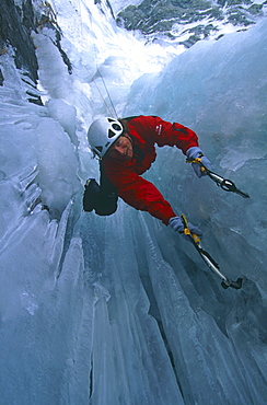 Philippe Magnin, ice climbs a frozen waterfall