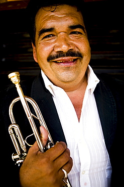 Mariachi trumpet player poses for a photo in Tijuana, BC, Mexico.