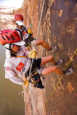 Adventure racers rappelling in a race in Moab, Utah (High Angle Perspective).