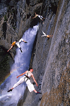 Suspended from wires 2,500 vertical feet up a cliffside in Yosemite National Park, the Bandaloop Troupe performs an air dance next to Yosemite Falls.