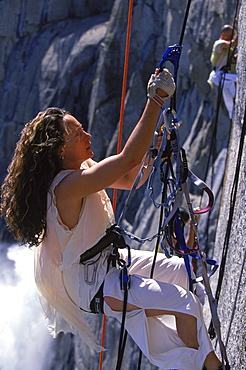 Amelia Rudolph, director of Project Bandalooop, ascends a rope after a performance.