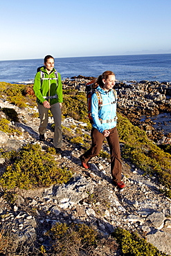 Katrin Schneider and Susann Scheller hiking on an ocean trail between Gansbaai and De Kelders. South Africa.