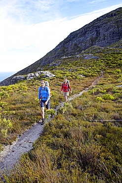 Katrin Schneider and Susann Scheller hiking on the Hoerikwaggo Trail from Cape Point to Table Mountain in Cape Town. South Africa.