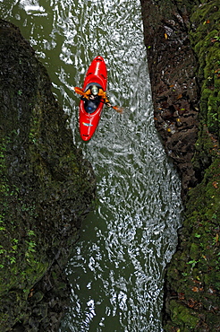 A man Paddles on the Alseseca River  in the Veracruz region of Mexico while scouting for huge whitewater.