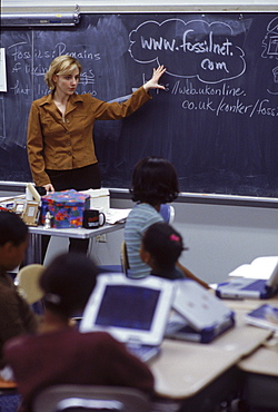 Fifth grade teacher Jenn Friday talks to students at Carmen Arace Middle School in Bloomfield, CT.