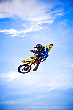 A motocross biker performs a stunt in the sky in Brainerd, Minnesota.