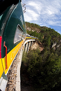 A train going above a bridge in Chihuahua, Mexico.