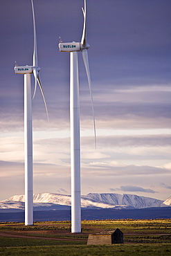 Wind turbines and the High Uinta Mountains at a wind farm in Southern Wyoming.