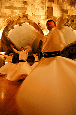 Whirling Dervishes: Men twirl in long whit robes as a part of a traditional Turkish Sema (ceremony).