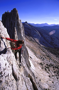 Roberta Nunes climbing Mathes Crest above Tuolumne Meadows in Yosemite National Park, California.