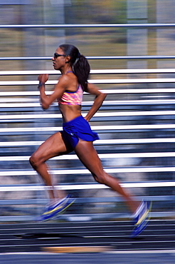 Yvonne Joyce running on a track in Vail, Colorado.