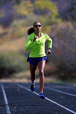 Yvonne Joyce running on a track in Vail, Colorado.