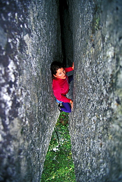 Sue McDevitt climbing Generator Crack 5.10 in Yosemite National Park, California.