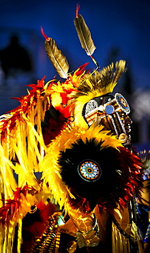 A Native American man participates in a dance at a powwow in Mesa Verde, Colorado.